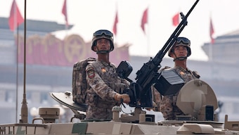 Members of the People's Liberation Army Ground Assault Force stand on an armoured vehicle in amphibious assault vehicle formation during a military parade to mark the 80th anniversary of the end of World War Two, in Beijing, China, September 3, 2025. Reuters
