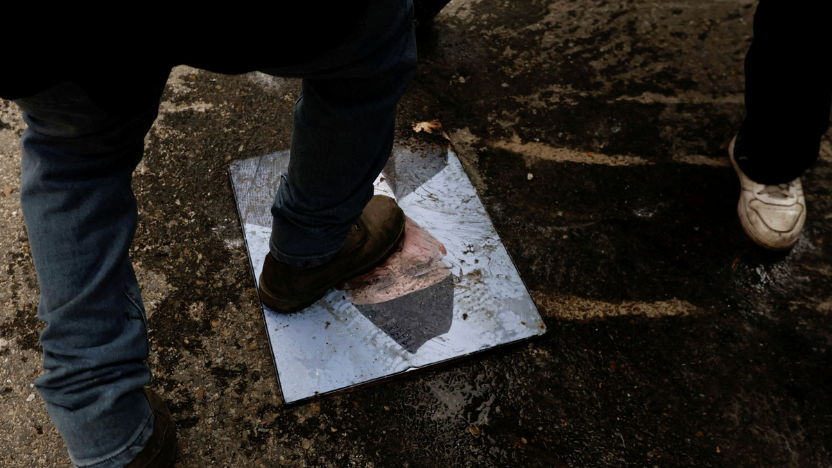 A demonstrator steps on the portrait of KP Sharma Oli, who resigned as Nepal's Prime Minister on Tuesday. Reuters A demonstrator steps on the portrait of KP Sharma Oli, who resigned as Nepal's Prime Minister on Tuesday. Reuters