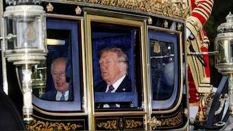 Britain's King Charles and U.S. President Donald Trump sit in a carriage during a procession through Windsor Castle, in Windsor, Britain, September 17, 2025. Reuters