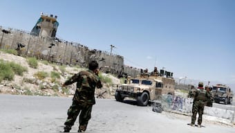 (File) Afghan soldiers stand guard at a checkpoint outside the US Bagram air base, on the day the last of American troops vacated it, Parwan province, Afghanistan on July 2, 2021. Reuters