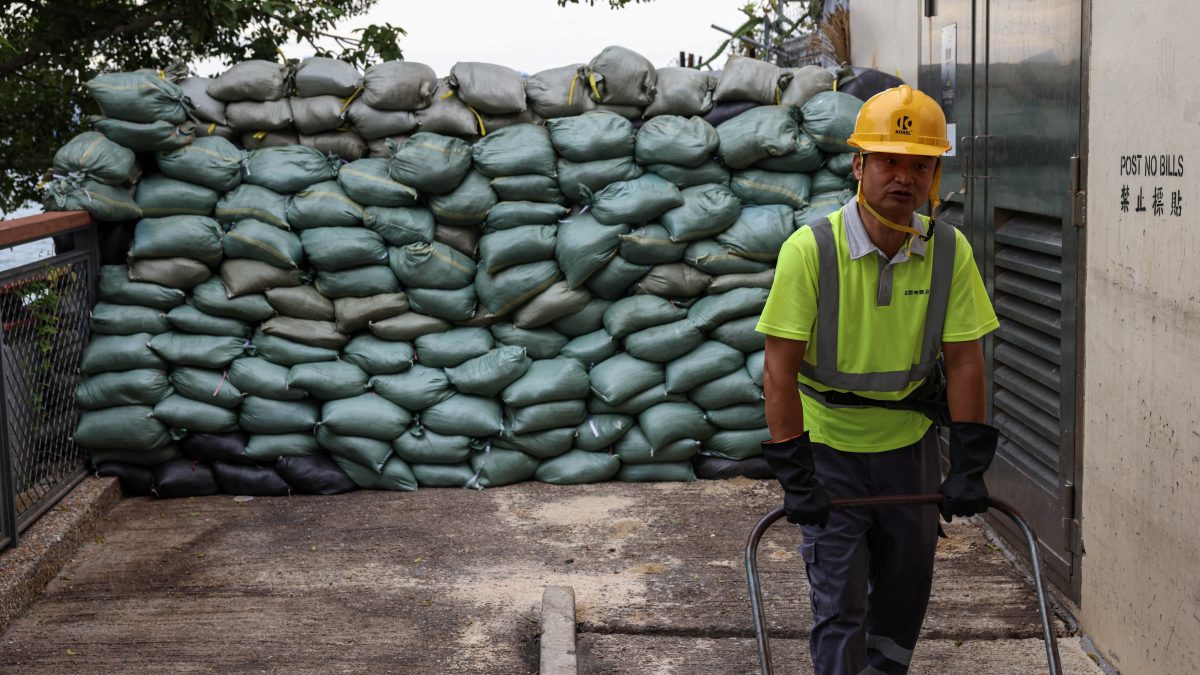 A worker stands in front of sand bags placed in preparation for Super Typhoon Ragasa, in Hong Kong, China on September 23, 2025. Reuters A worker stands in front of sand bags placed in preparation for Super Typhoon Ragasa, in Hong Kong, China on September 23, 2025. Reuters