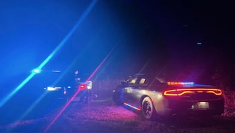 Law enforcement personnel respond to a helicopter crash near Joint Base Lewis-McChord, Wash., on Wednesday. AP