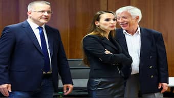 The AfD’s candidate for Gelsenkirchen mayor, Norbert Emmerich (right), and the party’s Enxhi Seli-Zacharias (centre) react to the exit polls in Gelsenkirchen. AFP
