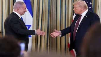 US President Donald Trump and Israeli Prime Minister Benjamin Netanyahu reach to shake hands at a joint press conference, the White House, Washington, DC, September 29, 2025. Image: Reuters