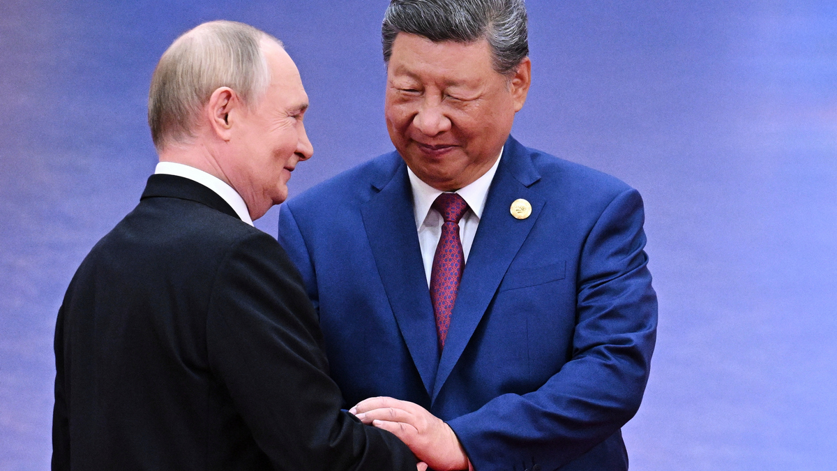 Russian President Vladimir Putin and Chinese President Xi Jinping greet each other in Tianjin, China. AP Russian President Vladimir Putin and Chinese President Xi Jinping greet each other in Tianjin, China. AP