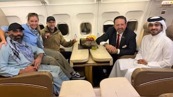 Amir Amiry, who had been detained in Afghanistan since December 2024, poses for a picture alongside Adam Boehler, the US special envoy for hostage response, Sebastian Gorka, the deputy assistant to the US president and senior director for counterterrorism, and a Qatari diplomat, on a plane from Kabul Afghanistan, September 28, 2025. File Image/Qatari Diplomat via Reuters