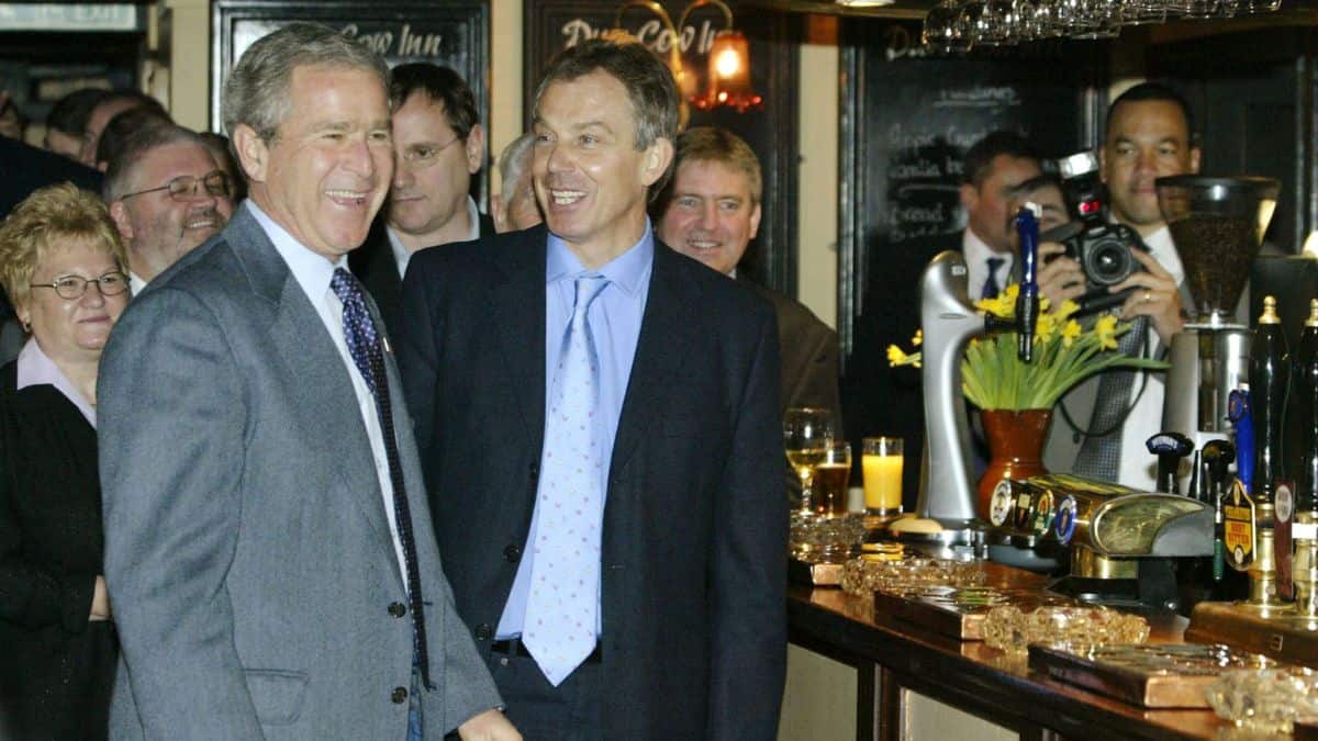 US President George W Bush jokes with British Prime Minister Tony Blair at the Dun Cow pub in Sedgefield, northern England, November 21, 2003. File Image/Reuters