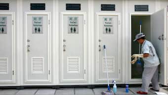 A worker cleans a newly installed public toilet at the Olympic Green in Beijing, China, July 21, 2008. Representational Image/Reuters