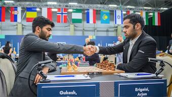 Indian GMs D Gukesh and Arjun Erigaisi shake hands after playing out a draw in Round 4 of the 2025 FIDE Grand Swiss. Image credit: FIDE