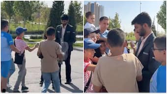 D Gukesh is surrounded by fans outside the venue where the FIDE Grand Swiss is currently taking place ahead of his fourth-round meeting with fellow Indian Grandmaster Arjun Erigaisi on Sunday. Image credit: Screengrab of video posted by Chessbase India on X