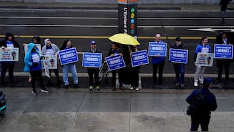 Labour union members hold placards on the day of a rally in support of federal workers during a rush hour protest outside the L'Enfant Plaza Metro Station in Washington, DC, US, March 24, 2025. File Image/Reuters