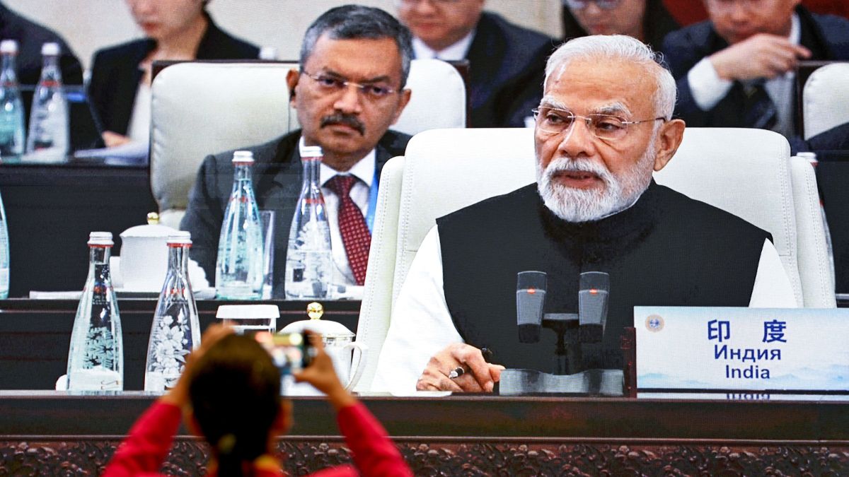 A woman takes a photo of a screen showing India's Prime Minister Narendra Modi attending the SCO Summit 2025 at the Meijiang Convention and Exhibition Centre in Tianjin, China, on September 1, 2025. (Photo: Wang Zhao/AFP) A woman takes a photo of a screen showing India's Prime Minister Narendra Modi attending the SCO Summit 2025 at the Meijiang Convention and Exhibition Centre in Tianjin, China, on September 1, 2025. (Photo: Wang Zhao/AFP)