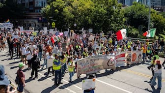 People participate in a Labor Day protest in Chicago, Illinois, US, September 1, 2025. Protesters march through the streets in anticipation of DHS agents coming to Chicago to enforce immigration raids. (Photo: Jim Vondruska/Reuters)