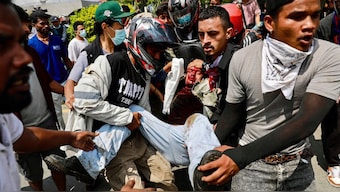 Demonstrators carry an injured victim during a protest outside the Parliament in Kathmandu on September 8, 2025, held to condemn the government over social media prohibitions and corruption. (Photo: Prabin Ranabhat/AFP)