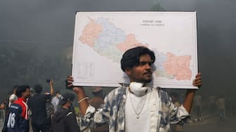 A demonstrator carries a map of Nepal takes part in a protest in Kathmandu, Nepal, on September 9, 2025. (Photo: Bikram Rai/Reuters)