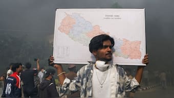 A demonstrator carries a map of Nepal takes part in a protest in Kathmandu, Nepal, on September 9, 2025. (Photo: Bikram Rai/Reuters)