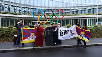 Chemi Lhamo and Golog Jigme Gyatso join protesters for a mock funeral outside the International Olympic Committee (IOC) headquarters as part of the No Beijing 2022 campaign, a coalition of over 180 rights groups that are calling for a boycott of Beijing 2022, in Lausanne, Switzerland November 26, 2021. (Representative Photo, Credit: Denis Balibouse/Reuters)