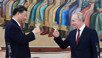 Russian President Vladimir Putin and China's President Xi Jinping make a toast during a reception following their talks at the Kremlin in Moscow on March 21, 2023. (Photo: Pavel Byrkin/Sputnik/AFP)