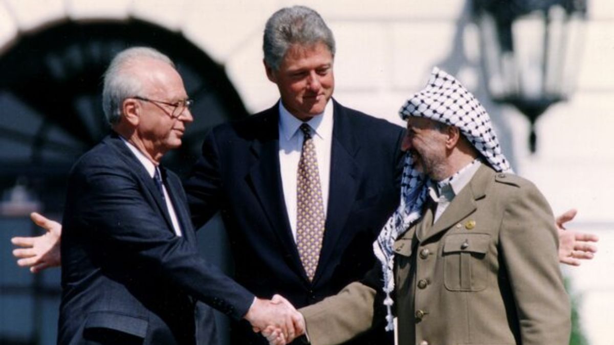 PLO Chairman Yasser Arafat (right) shake hands with Israeli Prime Minister Yitzhak Rabin (left), as US President Bill Clinton stands between them, after the signing of the Israeli-PLO peace accord. File image/Reuters PLO Chairman Yasser Arafat (right) shake hands with Israeli Prime Minister Yitzhak Rabin (left), as US President Bill Clinton stands between them, after the signing of the Israeli-PLO peace accord. File image/Reuters