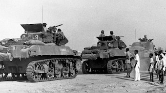 Civilians look at Indian Army tanks rolling into Hyderabad during Operation Polo. Wikimedia Commons