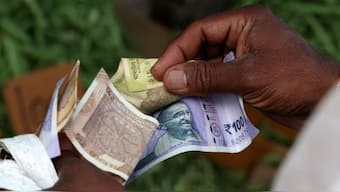 A man counts Indian currency notes at a market in Bengaluru, India, August 1, 2025. File Image/Reuters