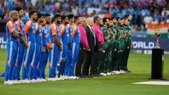 The Indian and the Pakistani teams sing their respective national anthems during their Asia Cup Group A match in Dubai on Sunday, 14 September. AP