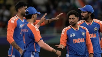 India spinner Kuldeep Yadav celebrates with teammates after dismissing UAE's Rahul Chopra during their Asia Cup match in Dubai on Wednesday, 10 September. AP