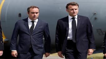 French President Emmanuel Macron, welcomed by French Minister of Armed Forces Sebastien Lecornu, walks on the tarmac after disembarking from an Airbus A400M military plane for a visit at the 55th International Paris Airshow at Le Bourget Airport near Paris, France, on June 20, 2025. Reuters File