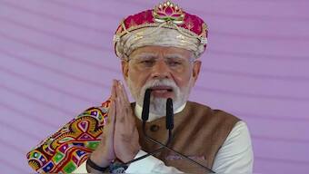 Prime Minister Narendra Modi greets the gathering in Madhya Pradesh's Dhar on Wednesday. ANI