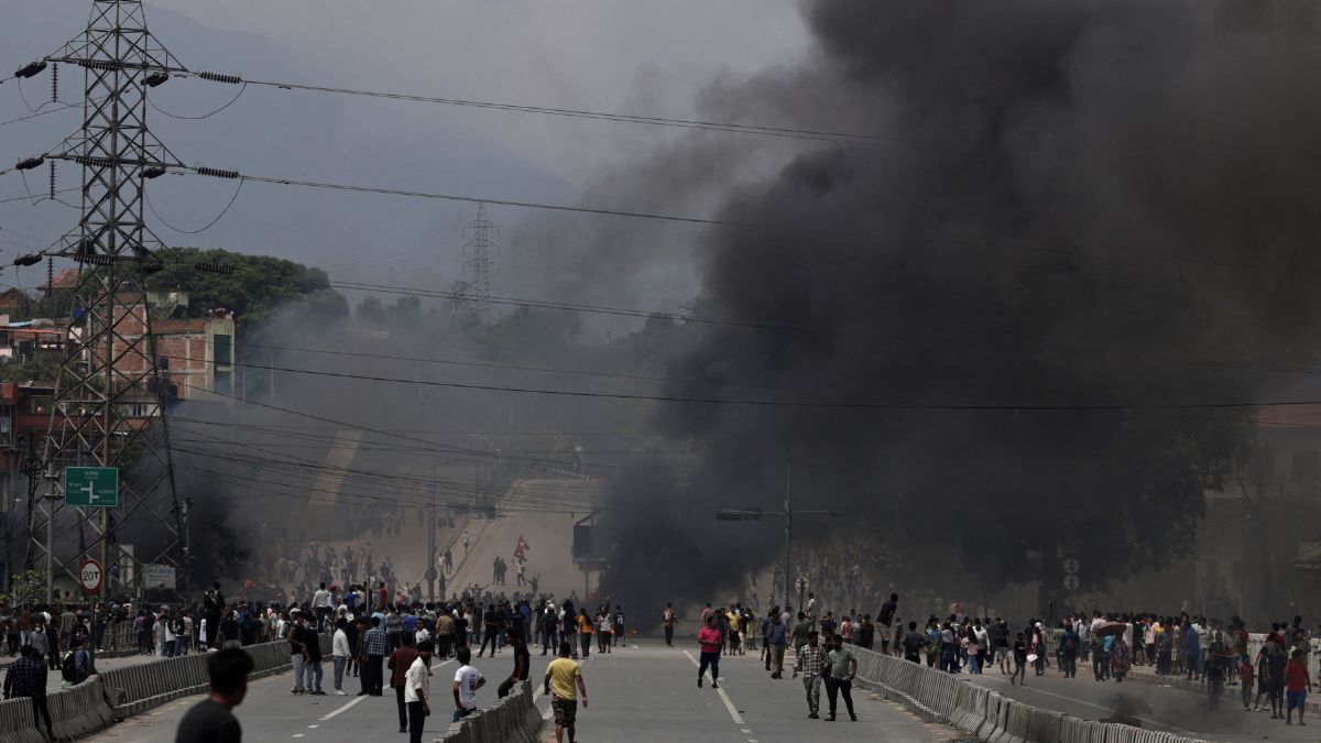Smoke rises as demonstrators gather to protest against Monday's killing of 19 people after anti-corruption protests that were triggered by a social media ban which was later lifted, during a curfew in Kathmandu, Nepal, September 9, 2025. File Image/Reuters