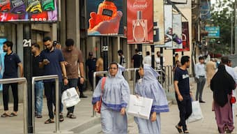 People walk outside shopping mall in Karachi, Pakistan, September 23, 2025. File Image/Reuters