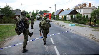 Soldiers walk next to a site where a roof of a house was destroyed, after Russian drones violated Polish airspace during an attack on Ukraine, with some being shot down by Poland with the backing from its Nato allies, in Wyryki, Lublin Voivodeship, Poland, September 10, 2025. File Image/Reuters