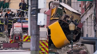 Emergency teams work at the site of a derailed electric streetcar in Lisbon, Portugal, September 3, 2025. File Image/AP