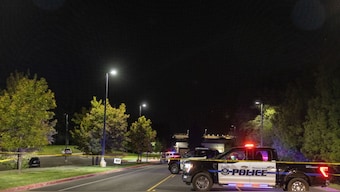 Police vehicles are seen outside Utah Valley University, placed on lockdown after youth activist and influencer Charlie Kirk was shot during a public event, in Orem, Utah, on September 10, 2025.  Image- AFP