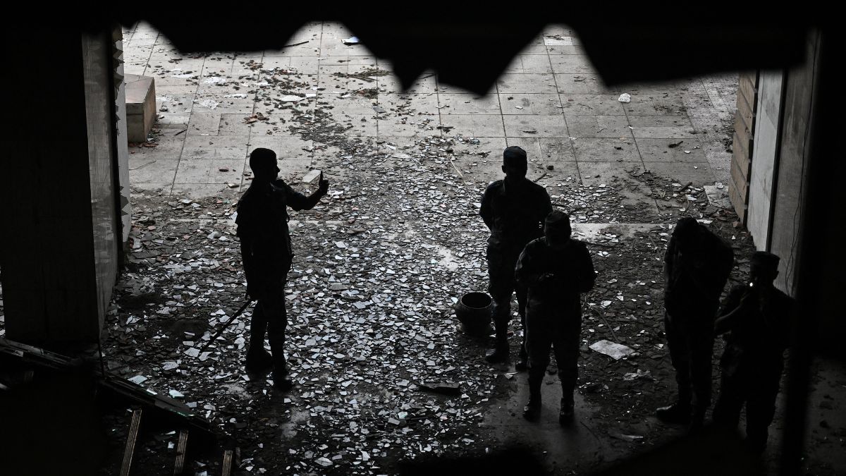 Security personnel inspect damages inside the torched Parliament building in Kathmandu on September 14, 2025. Image- AFP Security personnel inspect damages inside the torched Parliament building in Kathmandu on September 14, 2025. Image- AFP