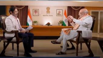 Union Home Minister Amit Shah with Network18 Group Editor-in-Chief Rahul Joshi. (Image: News18)
