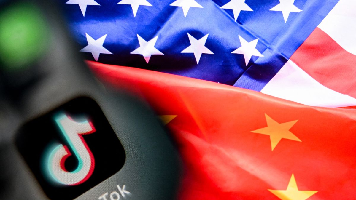 (FILES) A photo taken on April 10, 2025 shows the Chinese social networking service TikTok's logo on a smartphone screen (L) and US' and China flags combo illustration on a laptop screen in Frankfurt am Main, western Germany. Image- AFP (FILES) A photo taken on April 10, 2025 shows the Chinese social networking service TikTok's logo on a smartphone screen (L) and US' and China flags combo illustration on a laptop screen in Frankfurt am Main, western Germany. Image- AFP