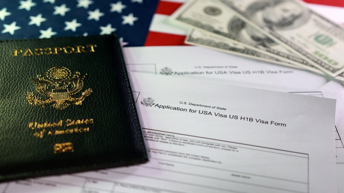 A US flag, a passport, mock US dollars and US H-1B Visa application forms are seen in this illustration taken, on Sunday. Reuters A US flag, a passport, mock US dollars and US H-1B Visa application forms are seen in this illustration taken, on Sunday. Reuters
