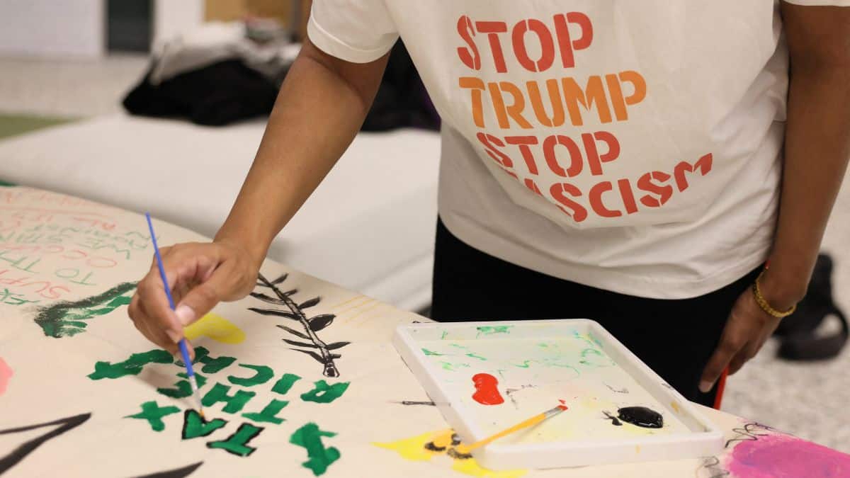 A member of the Stop Trump Coalition takes part in a collective banner making ahead a national demonstration against US President Donald Trump's state visit to the UK, in London, UK, September 14, 2025. File Image/Reuters
