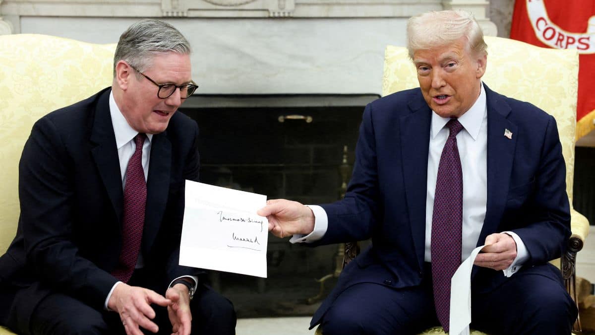 US President Donald Trump holds a letter from Britain's King Charles as he meets with British Prime Minister Keir Starmer in the Oval Office at the White House in Washington, DC, US, February 27, 2025. File Image/Reuters
