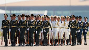 Honour guards stand as Serbian President Aleksandar Vucic (not pictured) arrives at the Beijing Capital International airport on September 2, 2025, to attend a military parade commemorating the 80th anniversary of the end of World War II and Japan's surrender. AFP