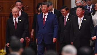 China’s President Xi Jinping (C), North Korea’s leader Kim Jong Un (R) and Russia’s President Vladimir Putin (L) arrive for a reception in the Great Hall of the People. AFP