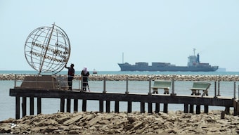 A container ship enters the Singapore Strait for the Strait of Malacca. Reuters