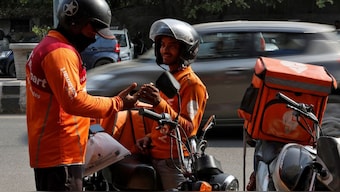 Gig workers prepare to deliver orders outside Swiggy's grocery warehouse at a market area in New Delhi, India, May 6, 2024. File Photo/Reuters