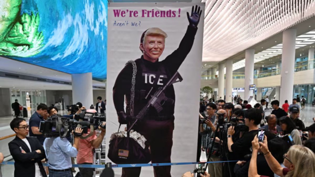 Protesters at Incheon airport with a banner questioning the US relationship with South Korea as 316 workers landed after their detention in an ICE raid. AFP Protesters at Incheon airport with a banner questioning the US relationship with South Korea as 316 workers landed after their detention in an ICE raid. AFP
