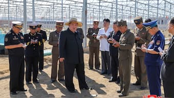  North Korea's leader Kim Jong Un (C) inspecting the construction of a greenhouse farm and a regional development project in the city of Sinuiju, North Pyongan province. AFP