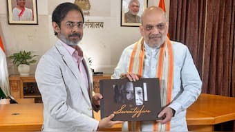 Union Minister Amit Shah presented Network18's coffee table book capturing PM Modi's life