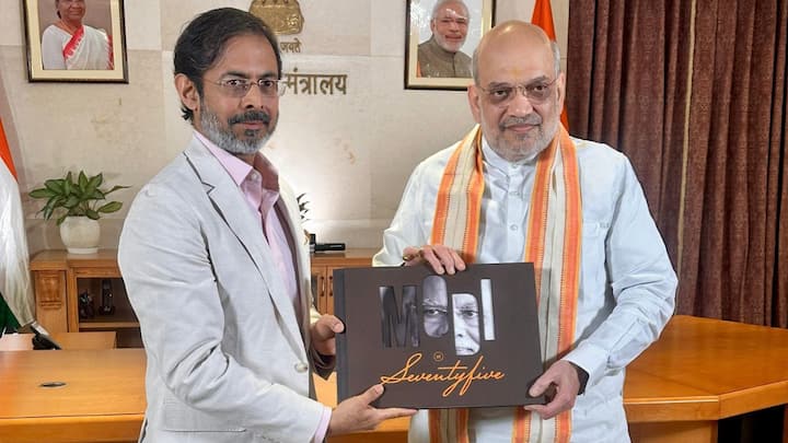 Union Minister Amit Shah presented Network18's coffee table book capturing PM Modi's life