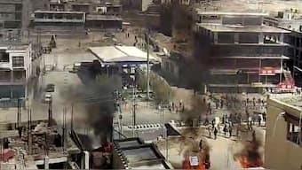 Smoke billows out from a structure set ablaze by miscreants amid a massive protest and shutdown, in Leh, Ladakh, September 24, 2025. PTI