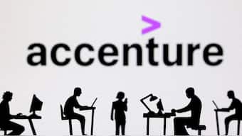 FILE PHOTO: Figurines with computers and smartphones are seen in front of Accenture logo in this illustration. Reuters